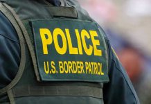 ICE Raid Mayhem: Congresswoman Claims Attack Police U.S. Border Patrol uniform close-up.