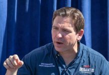 DeSantis Terror Label IGNITES Constitutional Firestorm Man in Desantis for President shirt speaking.