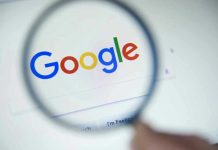Google’s AI Empire Under Siege – EU Strikes Hard Google logo viewed through a magnifying glass.