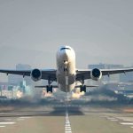 An airplane taking off from an airport runway