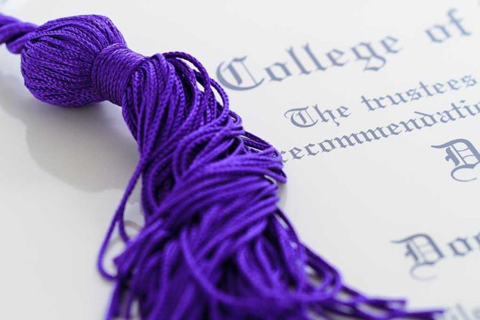 shutterstock_82636375.jpg Close-up of a purple graduation tassel next to a diploma