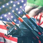 Trump’s Iran War Pitch Keeps Shifting Iran and USA flags with missile launcher.