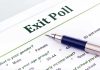 Close-up of an exit poll survey form with a pen