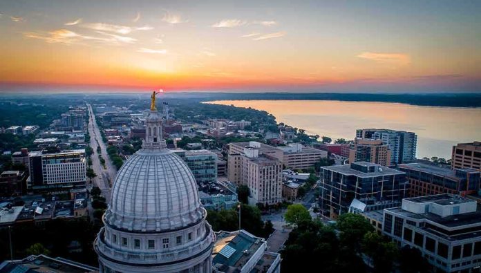Capitol dome overlooking city and lake at sunrise