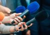 Male Workforce Vanishes — Economic Mayhem Looms Reporters holding colorful microphones